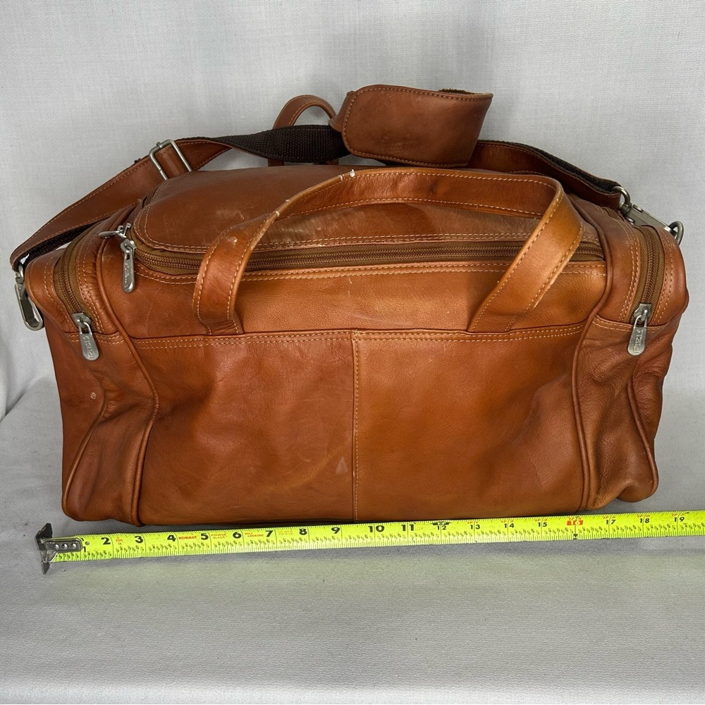 PIEL Genuine Cowhide Leather Traveler's Select Duffel Bag in saddle. 19”x 9”x9”